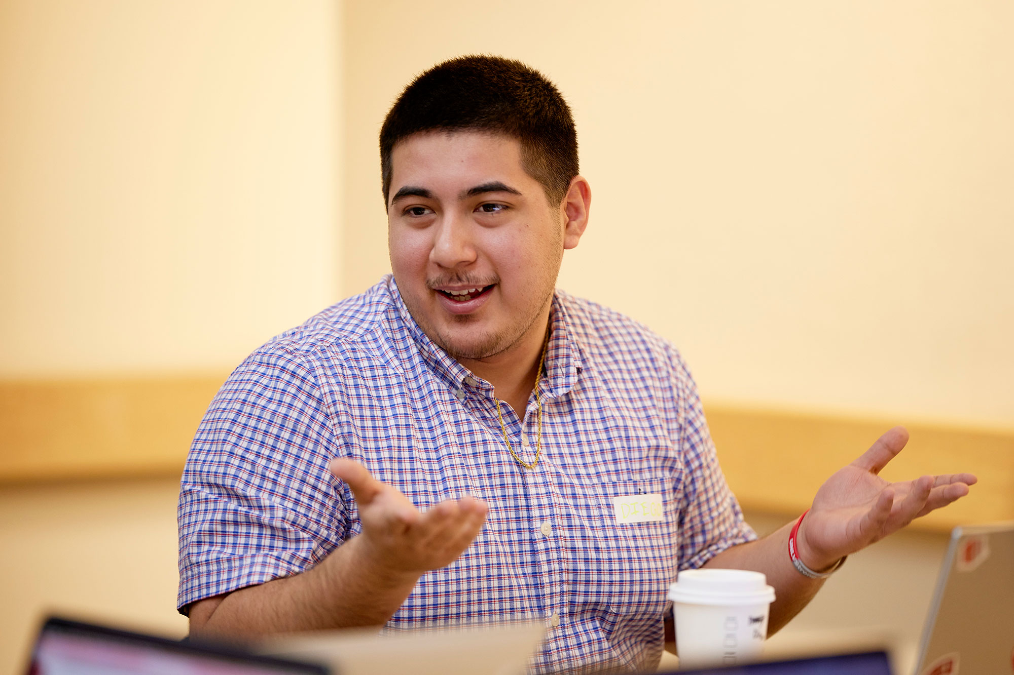 A man shoulder shrugs while having their hands palm up