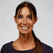 A woman smiling.