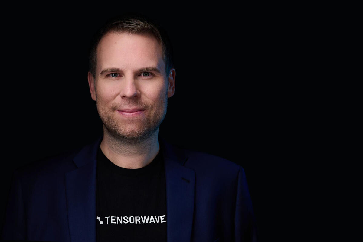 Piotr Tomasik wearing a shirt that says Tensorwave