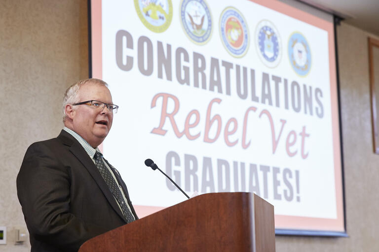 Ross Bryant speaking at a graduation ceremony