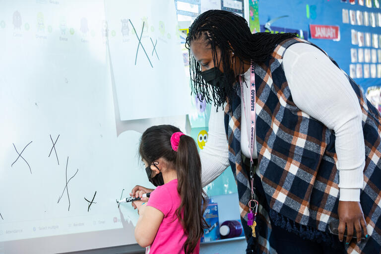 a teacher and student in a classroom