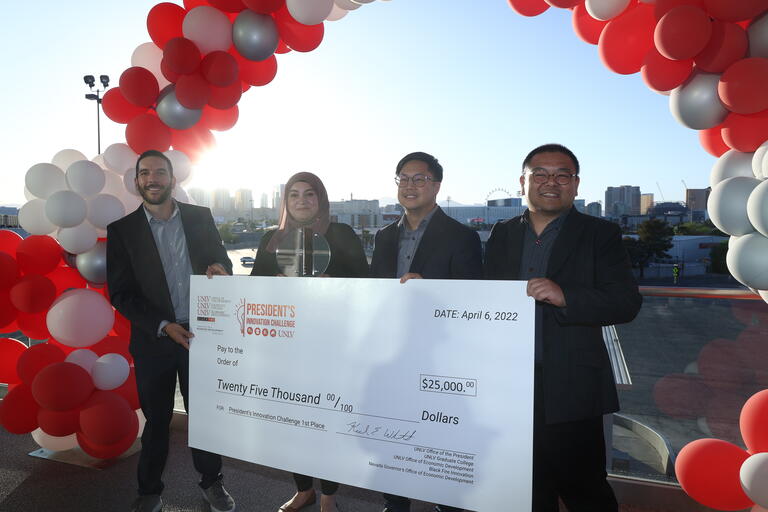U.N.L.V. students pose with check after winning innovation challenge