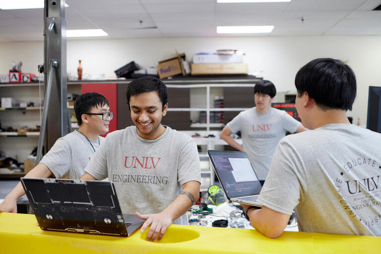 Engineering students working in a lab.