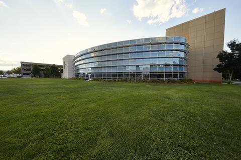 lawn with Student Recreation and Wellness Center in background